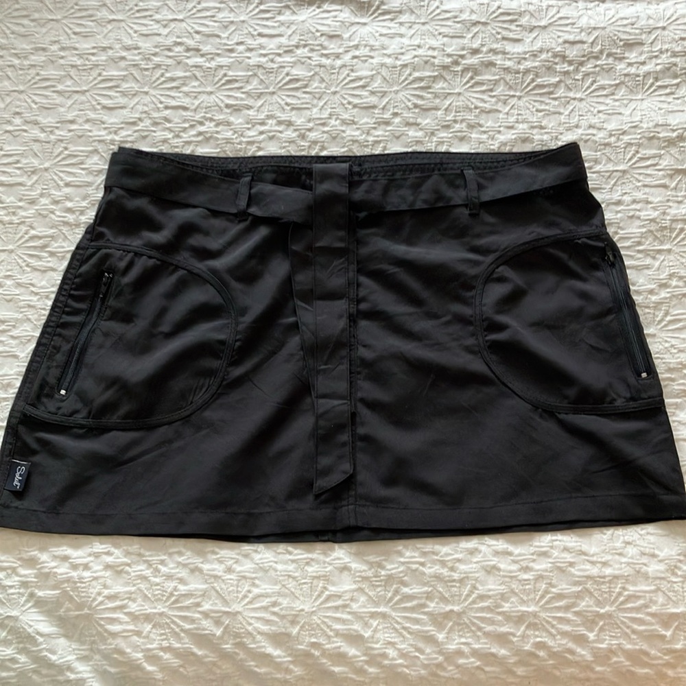 Black Swim skirt by Soleil with front snaps and waistband with tie & Zip pockets
